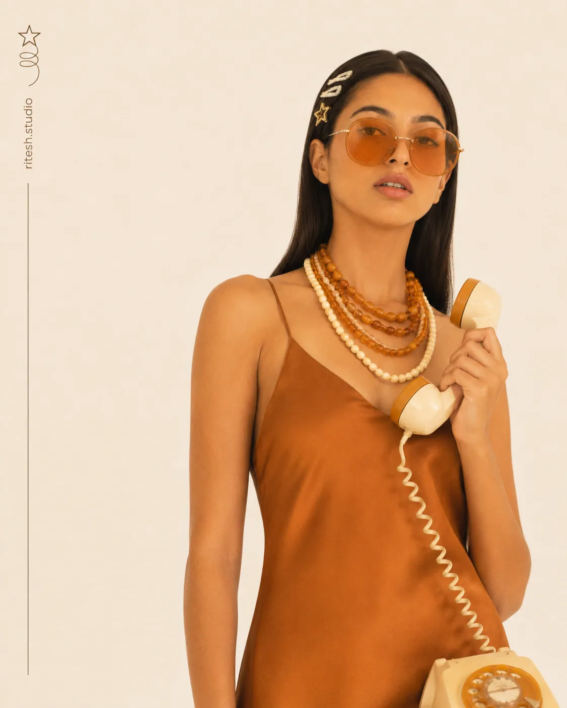Portrait in amber clothing with orange sunglasses