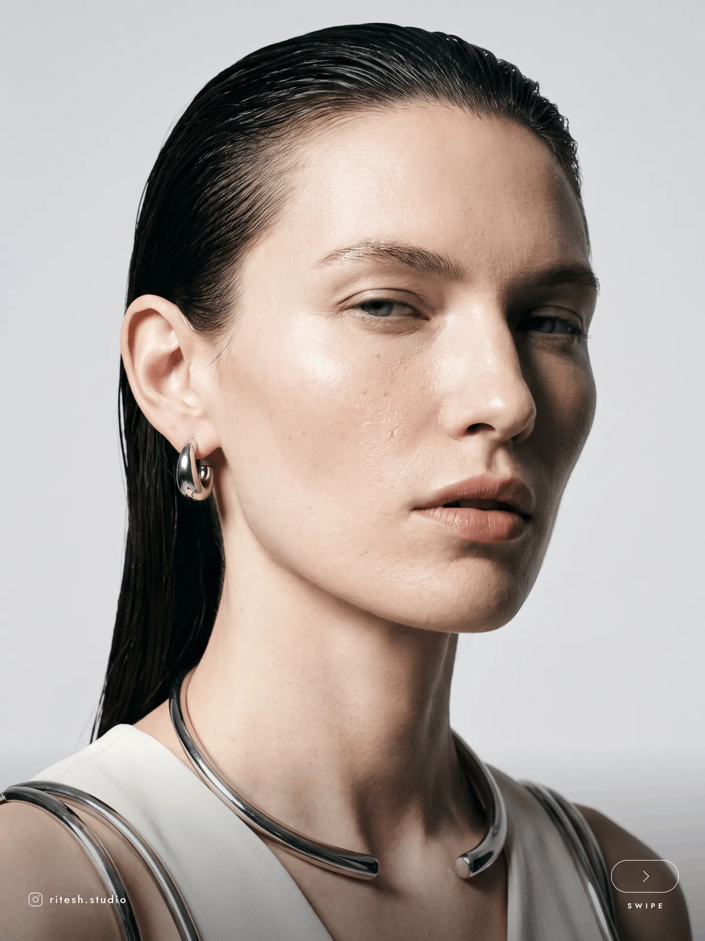 Beauty portrait with slicked-back hair and natural skin texture